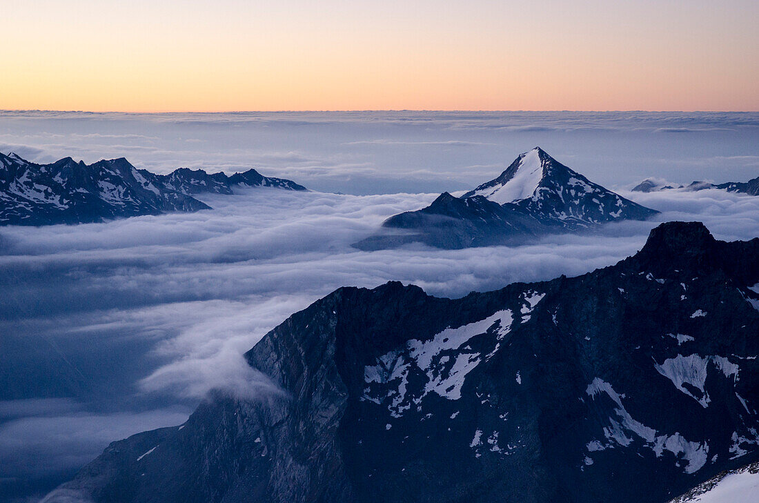 The Stellihorn protruding from a sea of clouds, early morning, Southern Visp Valley, Pennine Alps, canton of Valais, Switzerland