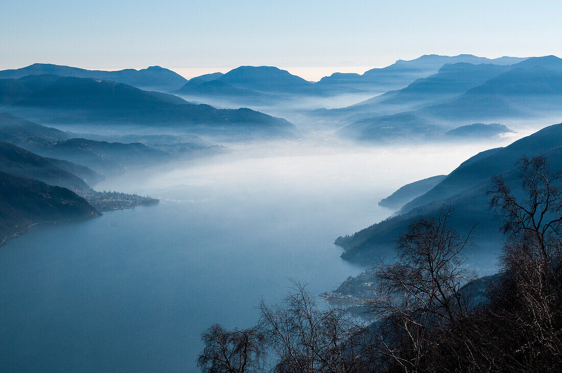 Lake Maggiore and its surrounding mountains, canton of Ticino, Switzerland and in the background Italy