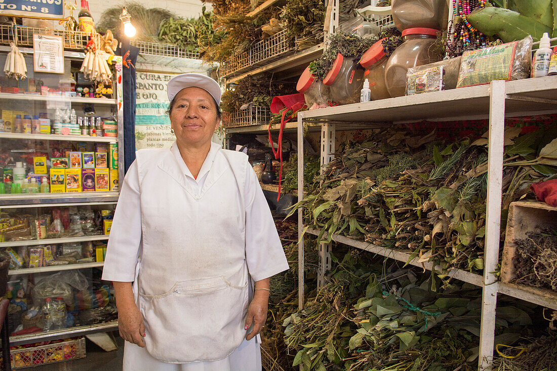 Herbal healer Rosa Mercedes in her shop in the San Francisco Market, which she shows to visitors during the walking tour through the historic city called Caminos de San Roque, Quito, Ecuador
