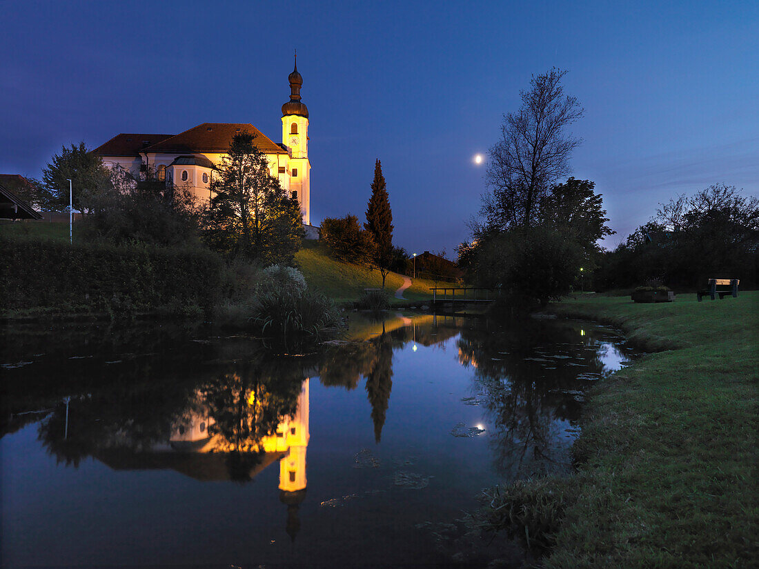 View over a pond to church, Breitbrunn am Chiemsee, Bavaria, Germany