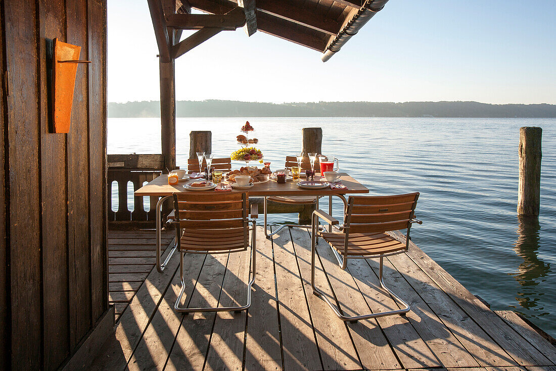 Breakfast-table at a boatshed, Lake Starnberger See, Bavaria, Germany