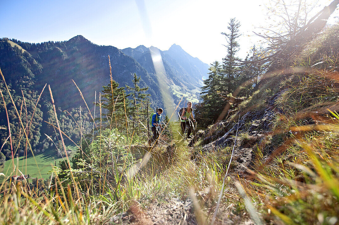 A men and a woman hiking in the mountains, Oberstdorf, Bavaria, Germany