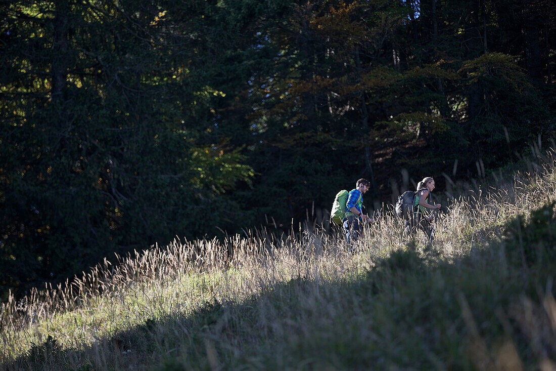 A man and a woman hiking in the mountains, Oberstdorf, Bavaria, Germany