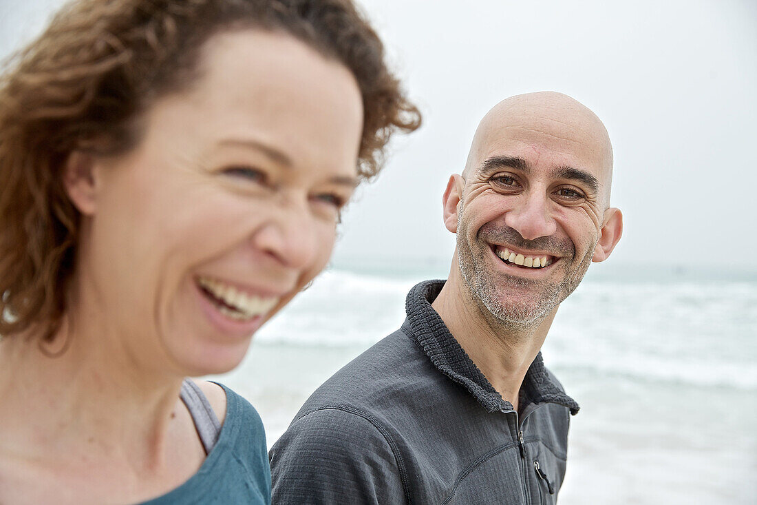 Young couple standing at the sea, Mallorca, Spain