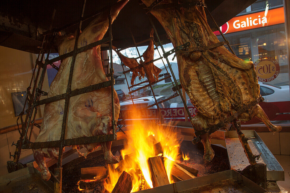 Lamb asada grills at La Estanca Parrilla steak restaurant, Ushuaia, Tierra del Fuego, Patagonia, Argentina