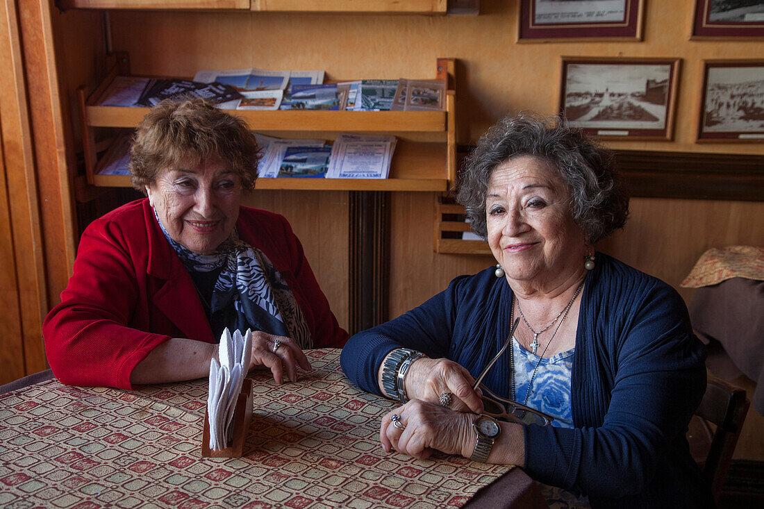 Sisters inside Baeriswyl Chocolatta chcolate shop and cafe, Punta Arenas, Magallanes y de la Antartica Chilena, Patagonia, Chile