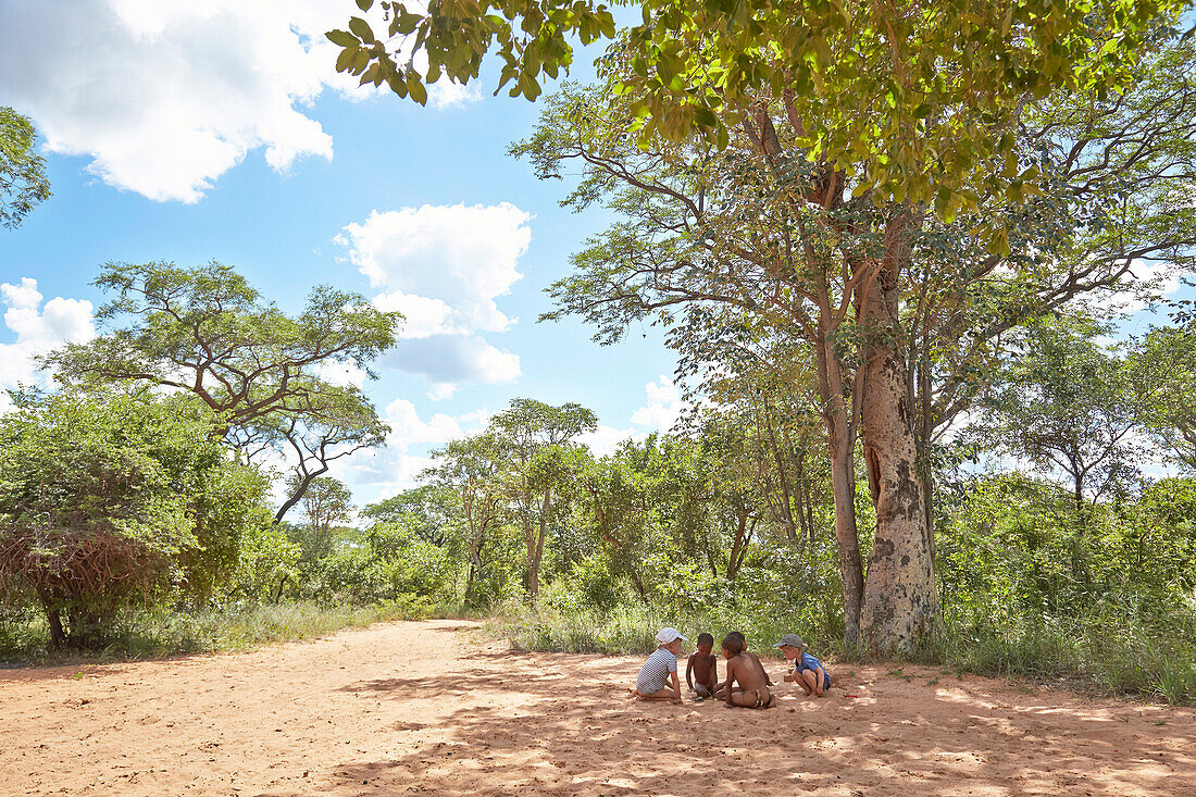 Children playing in sand, Khaudum, Namibia