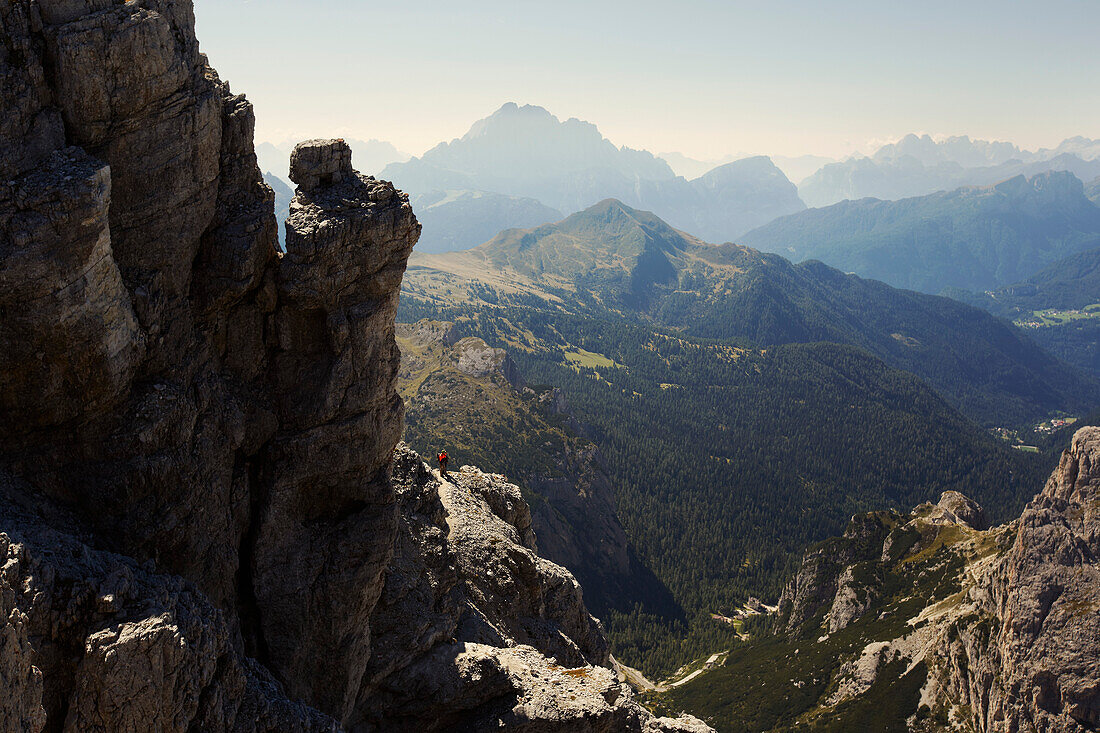 Hiker under the peak of Lagazuoi, the Dolomites, Belluno, Veneto, Italy