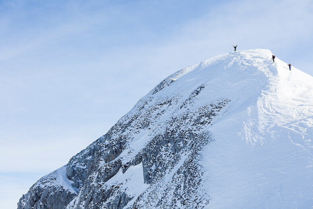 Backcountry skiers on Sonntagskogel peak, Tennengebirge mountains, Salzburg, Austria