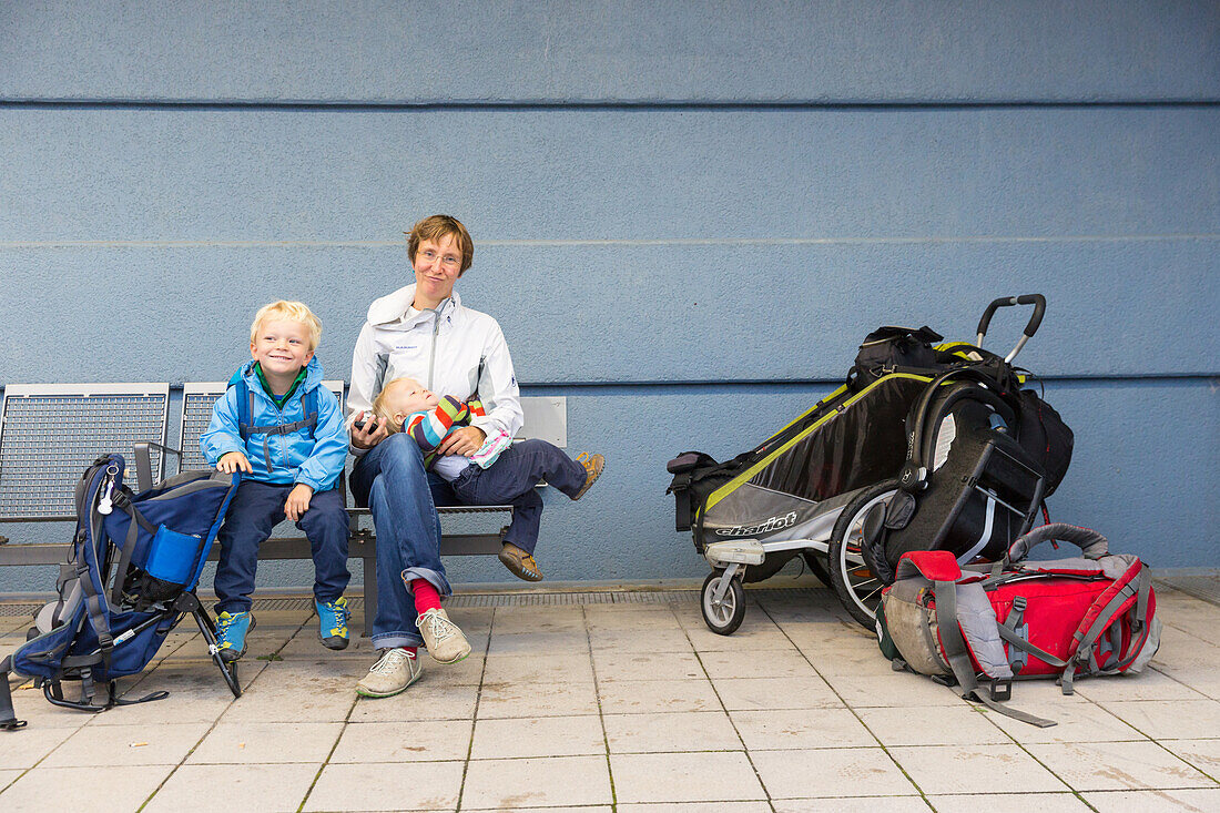 Mother and children waiting at a subway station, on their way on holiday, MR, Leipzig, Saxonia, Germany, Europe