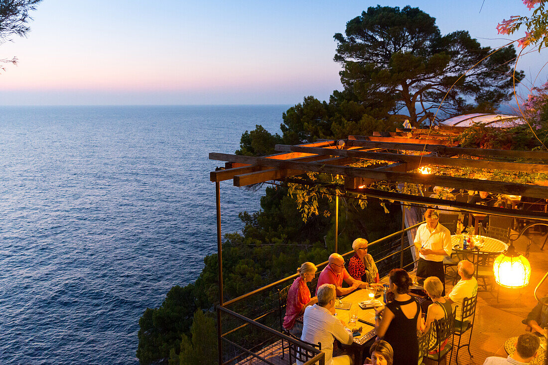 restaurant Nautilus at sunset, guests having dinner, Mediterranean Sea, Port de Soller, Serra de Tramuntana, Majorca, Balearic Islands, Spain, Europe