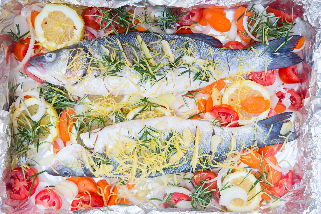 Gilthead seabream fish with lemon and fresh herbs, local food, Majorca, Balearic Islands, Spain, Europe