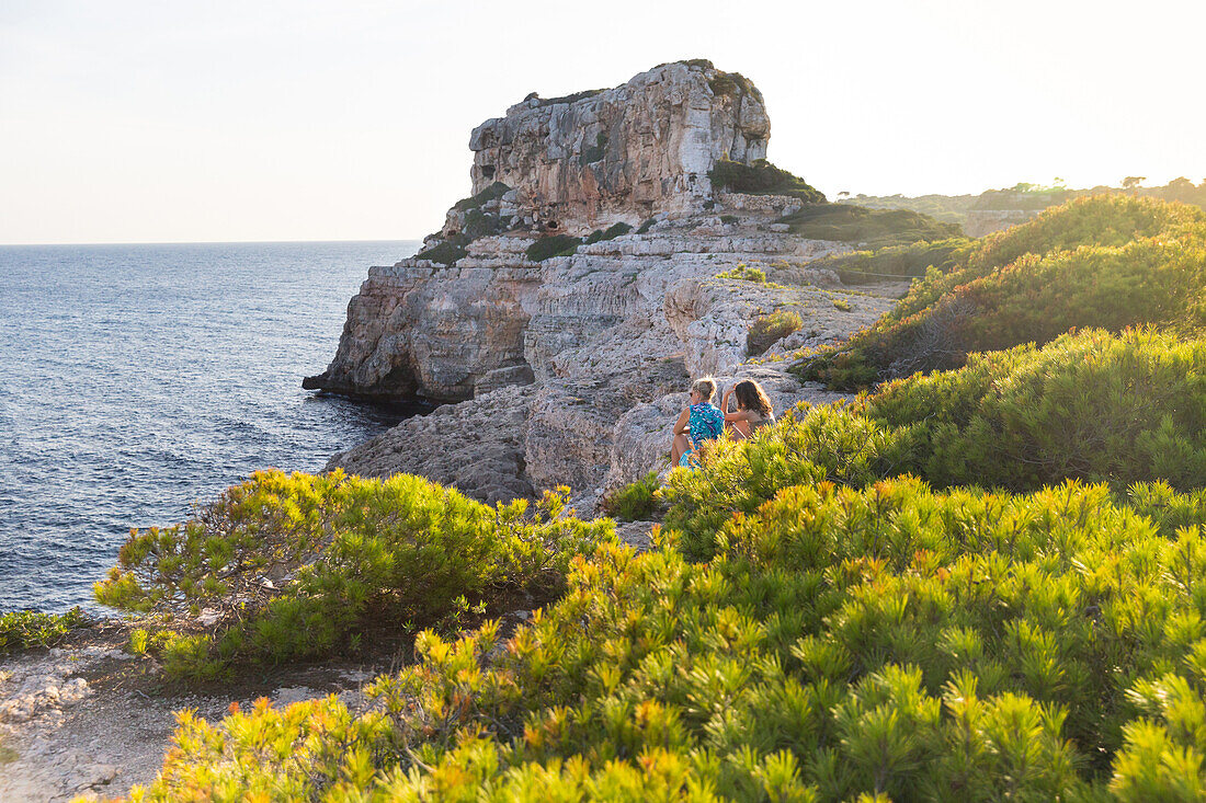 Coastal landscape and bay, Calo des Moro, tourists, Mediterranean Sea, near Santanyi, Majorca, Balearic Islands, Spain, Europe