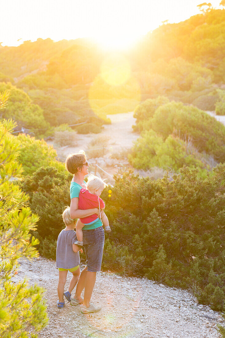 Mother with child and baby, 1 year old, in the evening sun, summer, Calo des Moro, Mediterranean Sea, MR, near Santanyi, Majorca, Balearic Islands, Spain, Europe