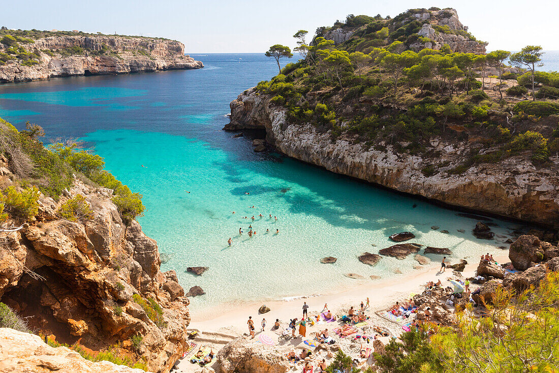 tourists on the beach, bay with turquoise blue sea, near Calo des Moro, Mediterranean Sea, near Santanyi, Majorca, Balearic Islands, Spain, Europe
