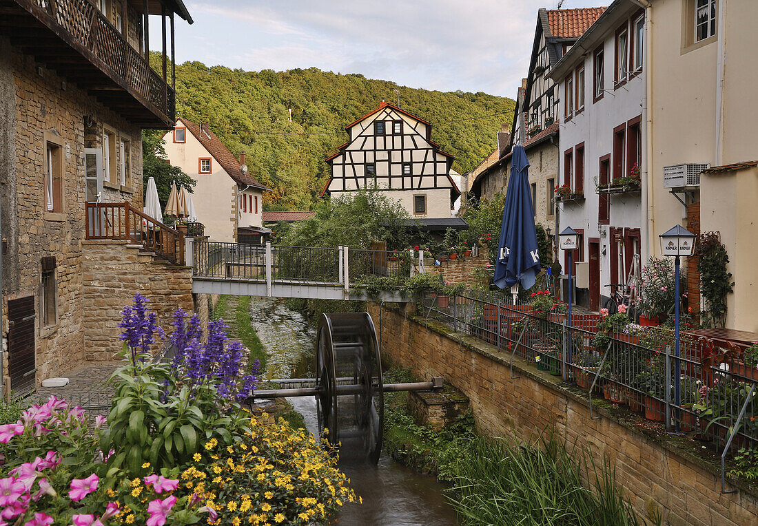 View from bridge near the town gate Untertor to a rivulet and mill-wheel, Meisenheim, Administrative district of Bad Kreuznach, Region of Nahe-Hunsrueck, Rhineland-Palatinate, Germany, Europe