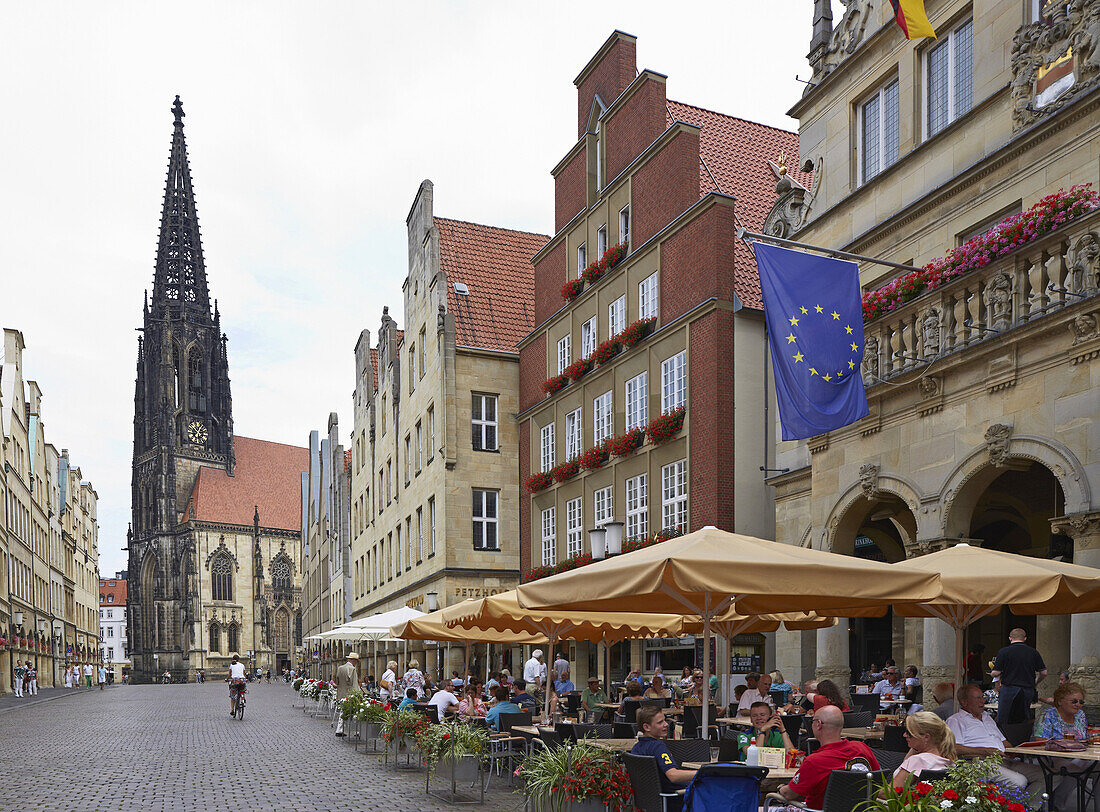 St. Lambert's Church and restaurants at Prinzipalmarkt , Muenster , Muensterland , North Rhine-Westphalia , Germany , Europe