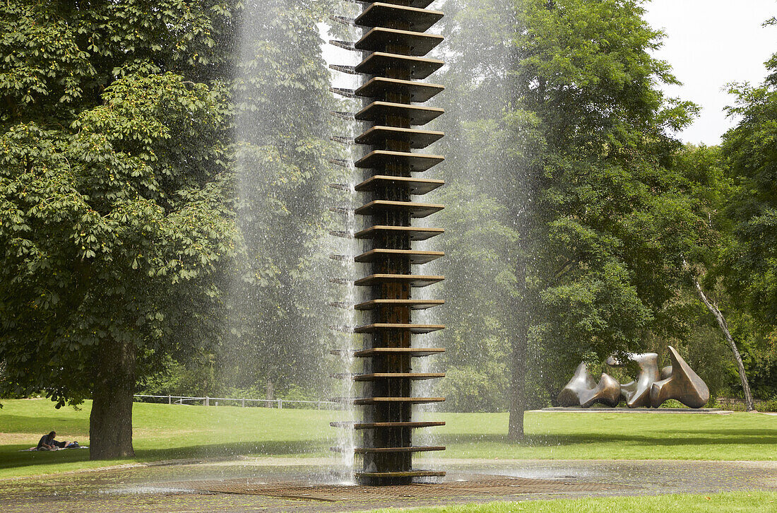 Well and sculpture Large Vertebrae by Henry Moore in park near the Aasee , Muenster , Muensterland , North Rhine-Westphalia , Germany , Europe