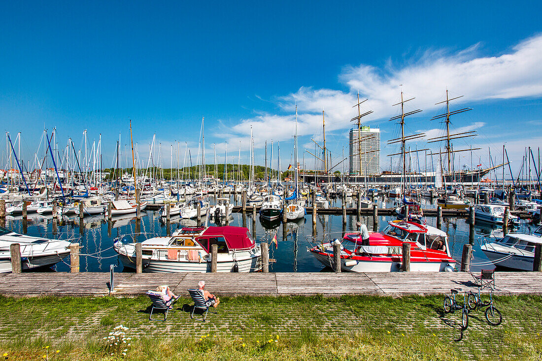 View across the Marina to a sailing ship, Hanseatic City, Luebeck Travemuende, Baltic Coast, Schleswig-Holstein, Germany