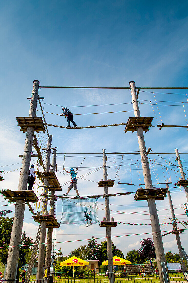 Climbing in the High wire garden, Groemitz, Baltic Coast, Schleswig-Holstein, Germany