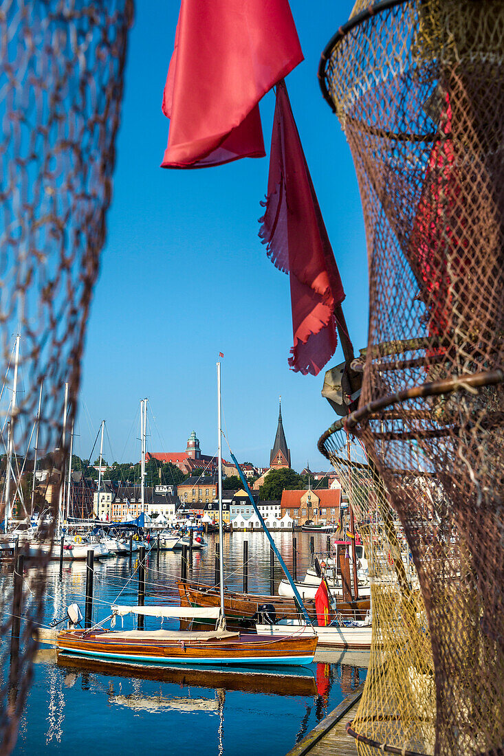 View through a fishing net towards the old town, Flensburg, Baltic Coast, Schleswig-Holstein, Germany