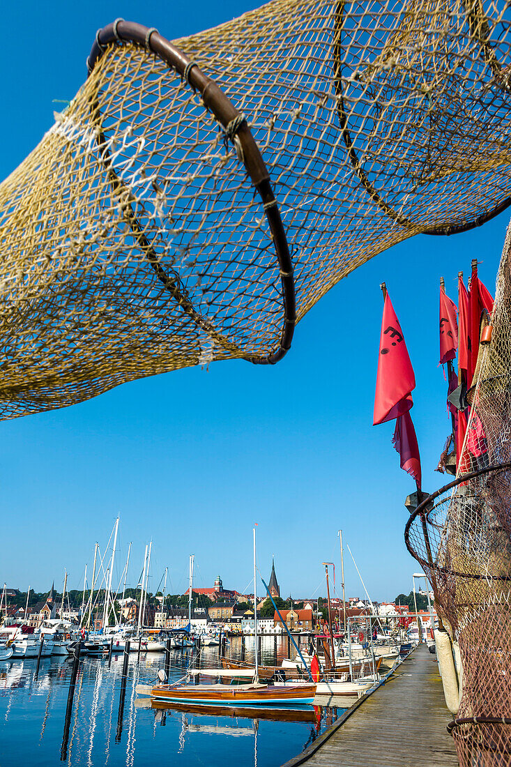 View through a fishing net towards the old town, Flensburg, Baltic Coast, Schleswig-Holstein, Germany