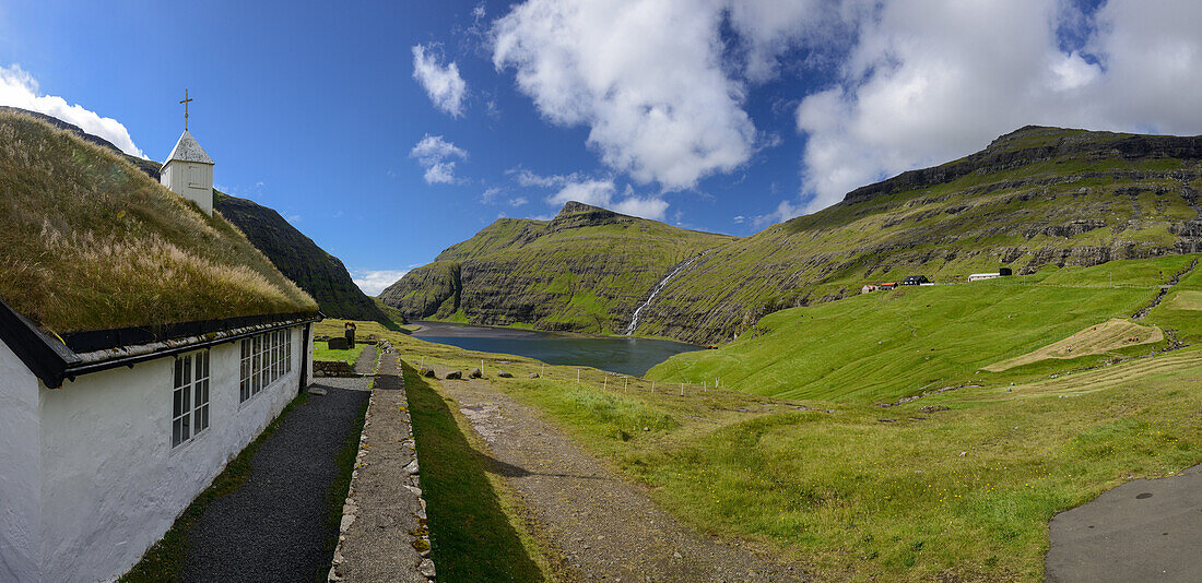 Church and lake with waterfall in Saksun, Streymoy Island, Faroe Islands