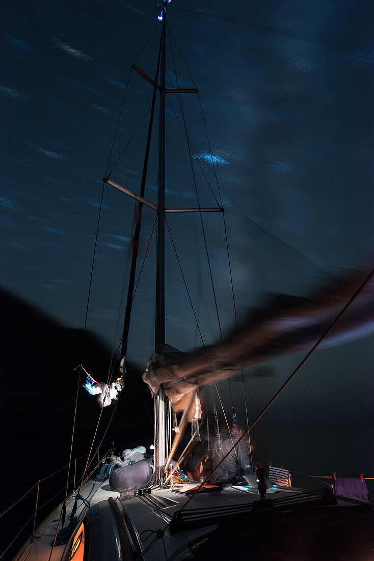 Starry sky above anchoring sailing yacht in a lonely bay on the Greek island Syphnos (Sifnos), Aegean, Cyclades, Greece