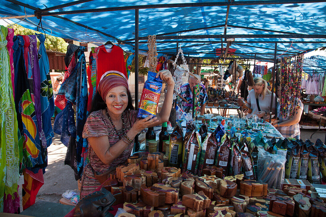 Woman sells coffee beans at souvenir and handicrafts stall at market, Puntarenas, Puntarenas, Costa Rica