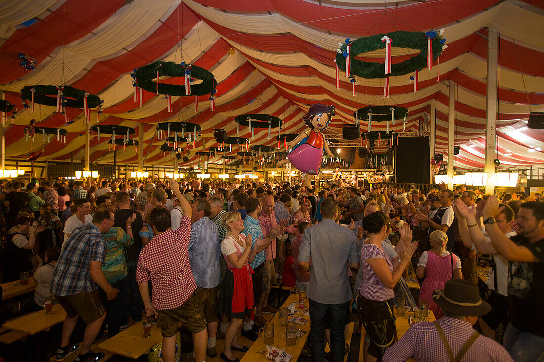 People party inside Stadel beer tent during Kulmbacher Bierwoche beer festival, Kulmbach, Franconia, Bavaria, Germany