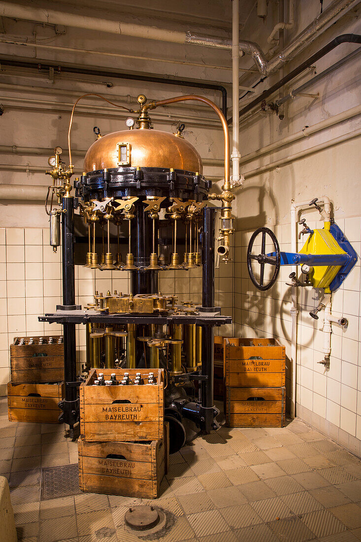Historic bottling machinery on display at Maisel's Brauereimuseum Bayreuth brewery museum, Bayreuth, Franconia, Bavaria, Germany