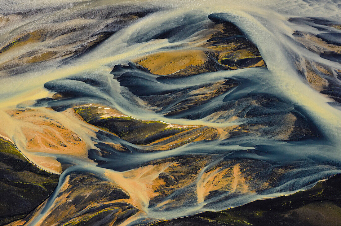 Aerial view of colorful meanders of  glacial river Thjorsa floating over the lava area (sander) Landeyarsandur, South Iceland, Iceland, Europe