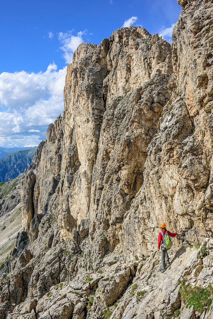 Woman doing fixed rope route Masare, Masare, Rotwand, Rosengarten, UNESCO world heritage Dolomites, Dolomites, Trentino, Italy