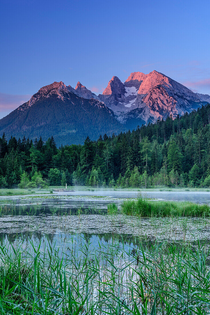 Mountain lake in front of Hochkalter in alpenglow, Berchtesgaden, Berchtesgaden Alps, Upper Bavaria, Bavaria, Germany