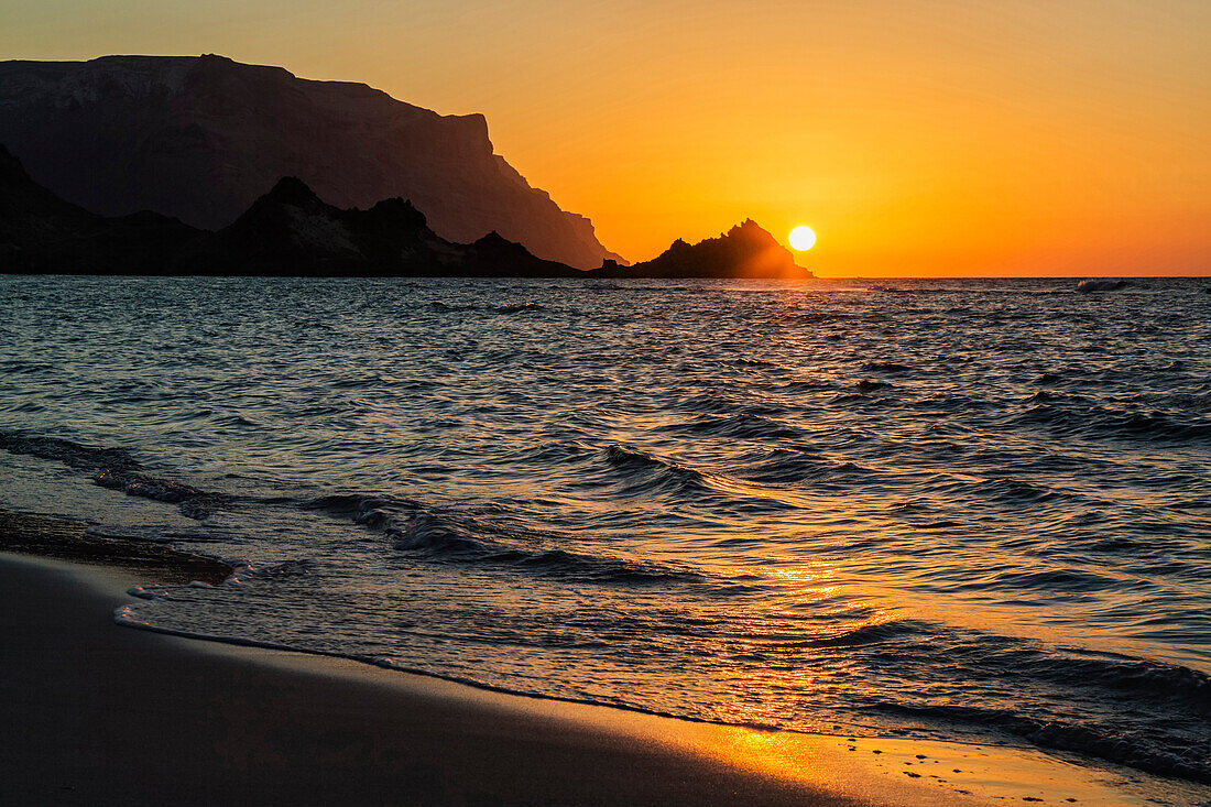 Sun setting over rocky coastline, Qalansyia, Socotra, Yemen, Qalansyia, Socotra, Yemen