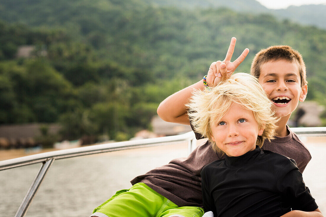 Children playing on deck of yacht, Sayulita, Nayarit, Mexico