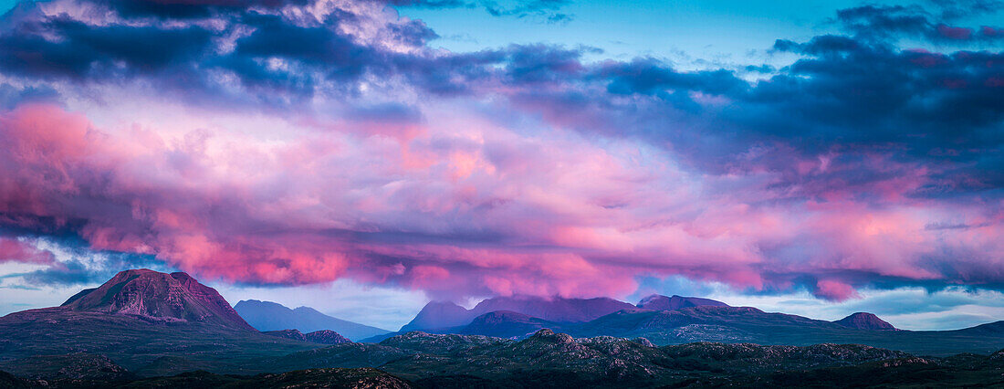 Panoramic view of pink clouds over remote landscape, Ullapool, Scotland, UK