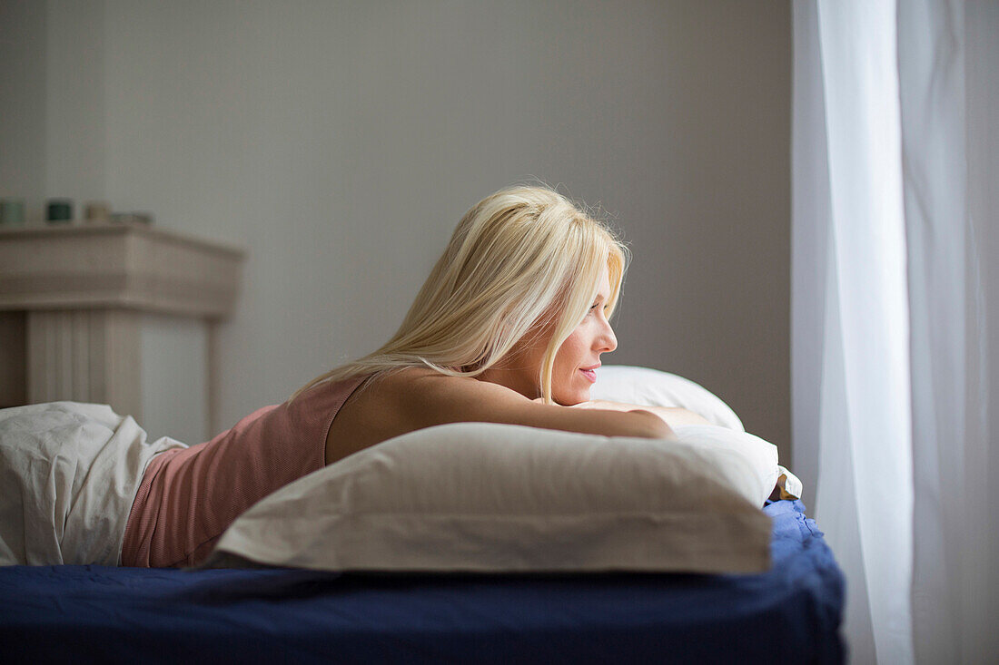 Caucasian woman laying in bed, Belgrade, Serbia, Serbia