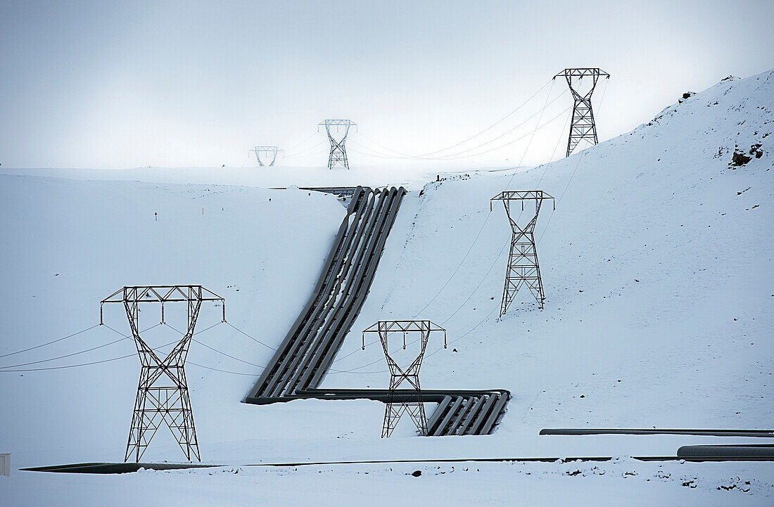 Power lines in snowy arctic landscape, Selfross, Sudhurland, Iceland