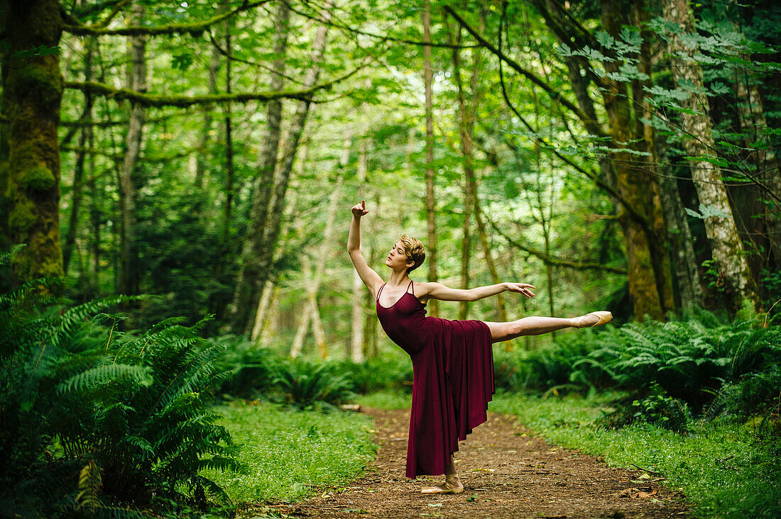 Caucasian woman dancing in forest, C1