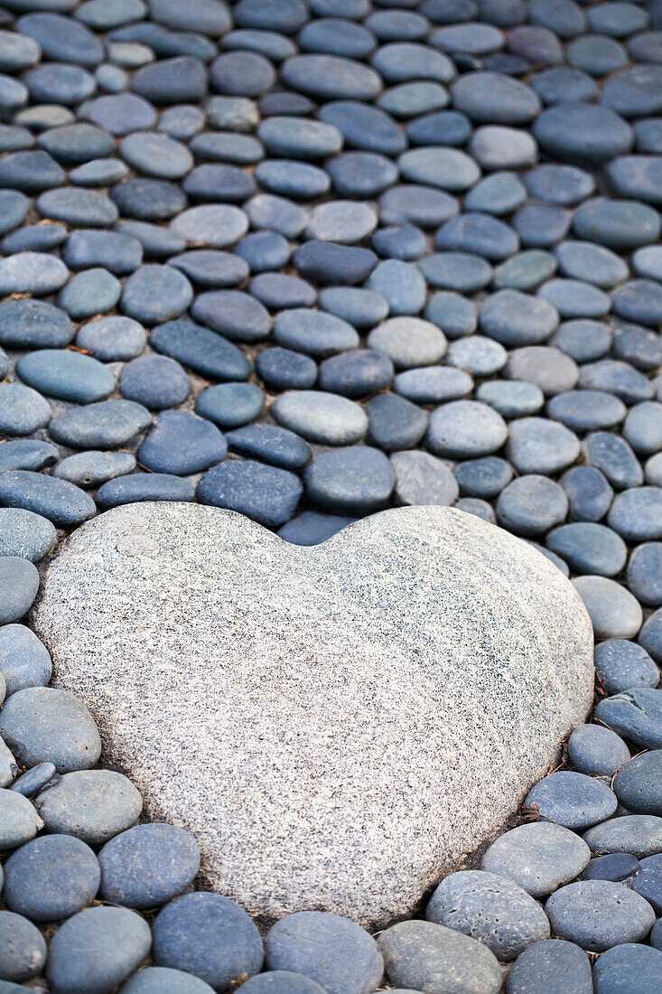 Heart-shaped stone on path, C1