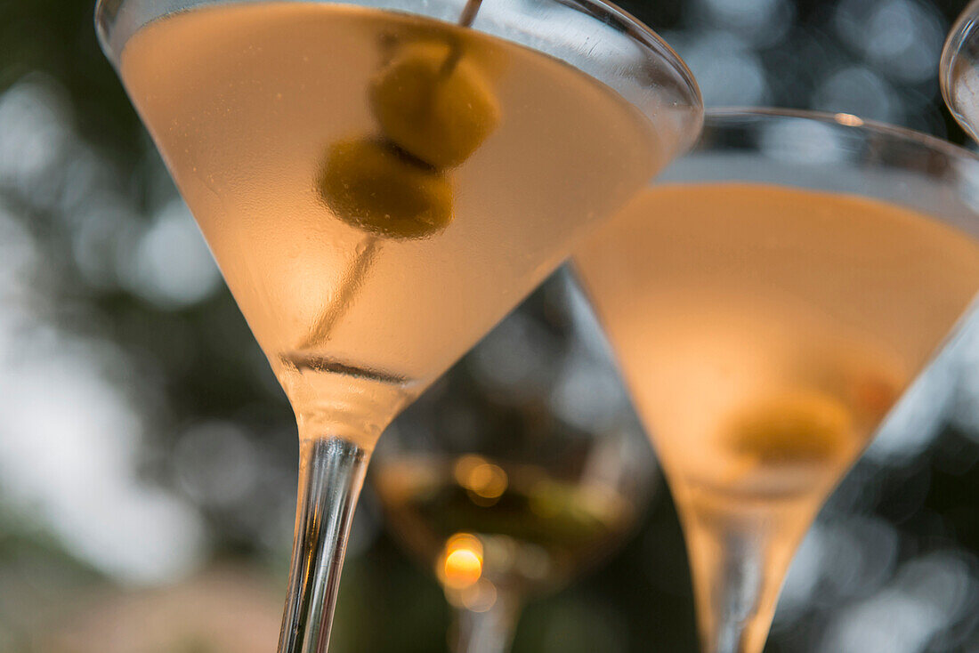 Close up of martinis with olives, C1