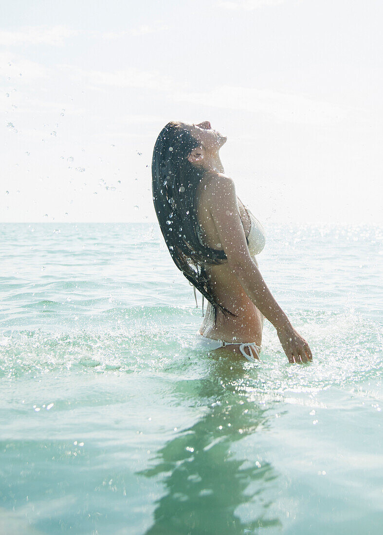 Caucasian woman wading in ocean, Jupiter, Florida, USA