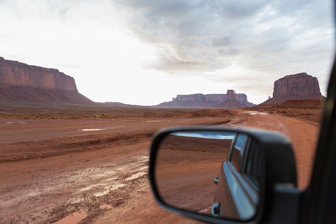 Rock formations and desert landscape viewed from car, Monument Valley, Utah, United States, Monument Valley, Utah, USA