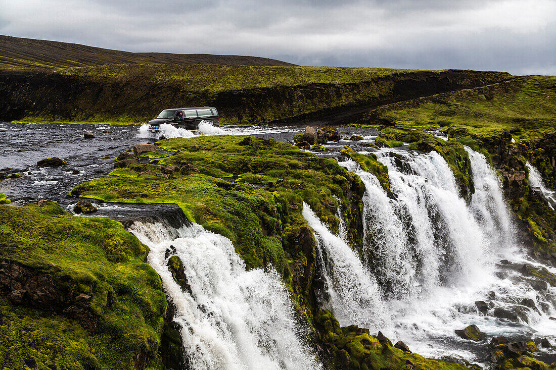 Waterfall flowing over rock formations in remote river, Southern Highlands, Iceland, Iceland