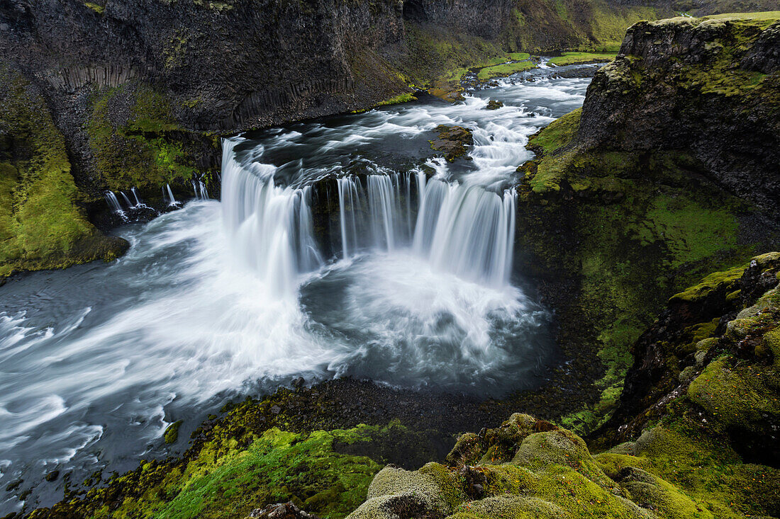 High angle view of waterfall and river in mountain rock formations, Southern Highlands, Iceland, Iceland