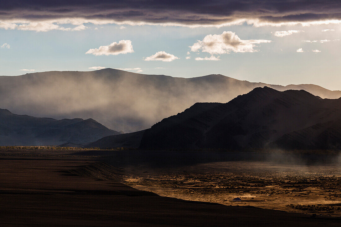 Mist rising from hills in desert landscape, Ulgii, Bayan Ulgii, Mongolia