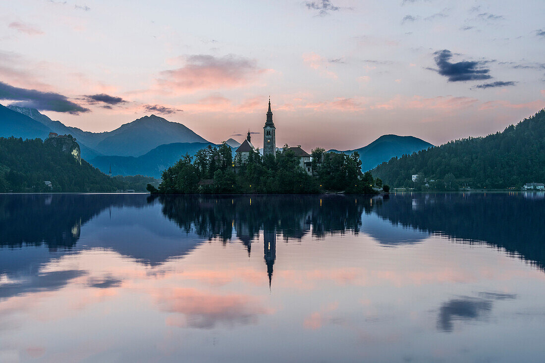 Village church and buildings reflected in still lake, Bled, Upper Carniola, Slovenia, Bled, Upper Carniola, Slovenia