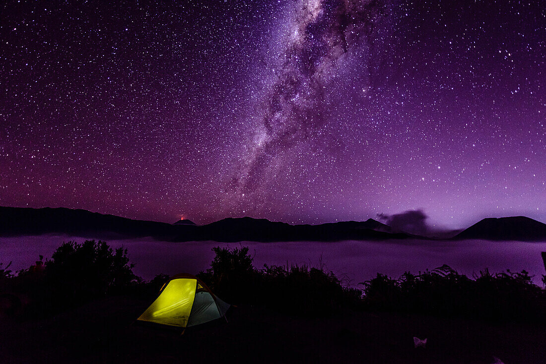 Milky Way galaxy over campsite in starry night sky, Mount Bromo, Surabaya, Indonesia