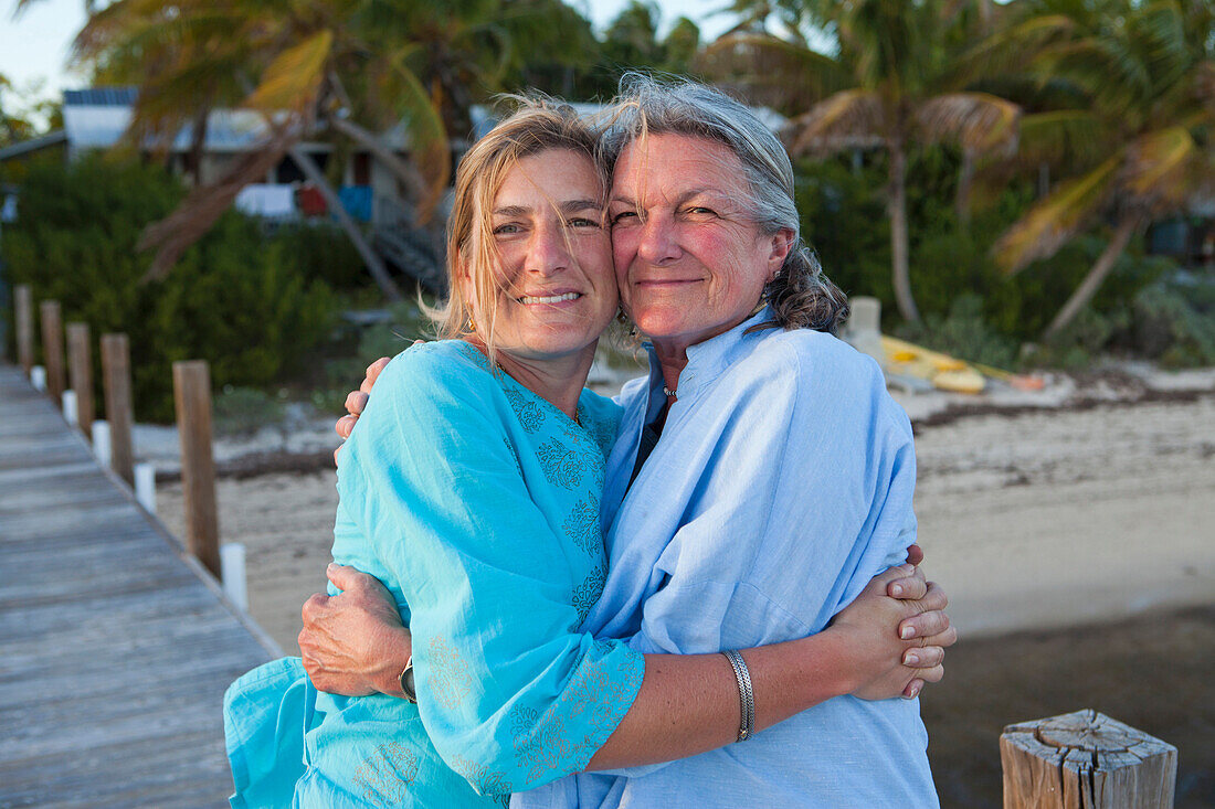 Caucasian mother and daughter hugging on pier, Florida Keys, Florida, USA